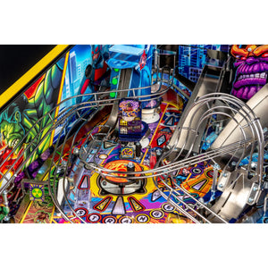 Close-up of a colorful Avengers pinball machine playfield with curved metallic rails, a central target area, and illustrated comic-style graphics including a purple muscular character on the right.